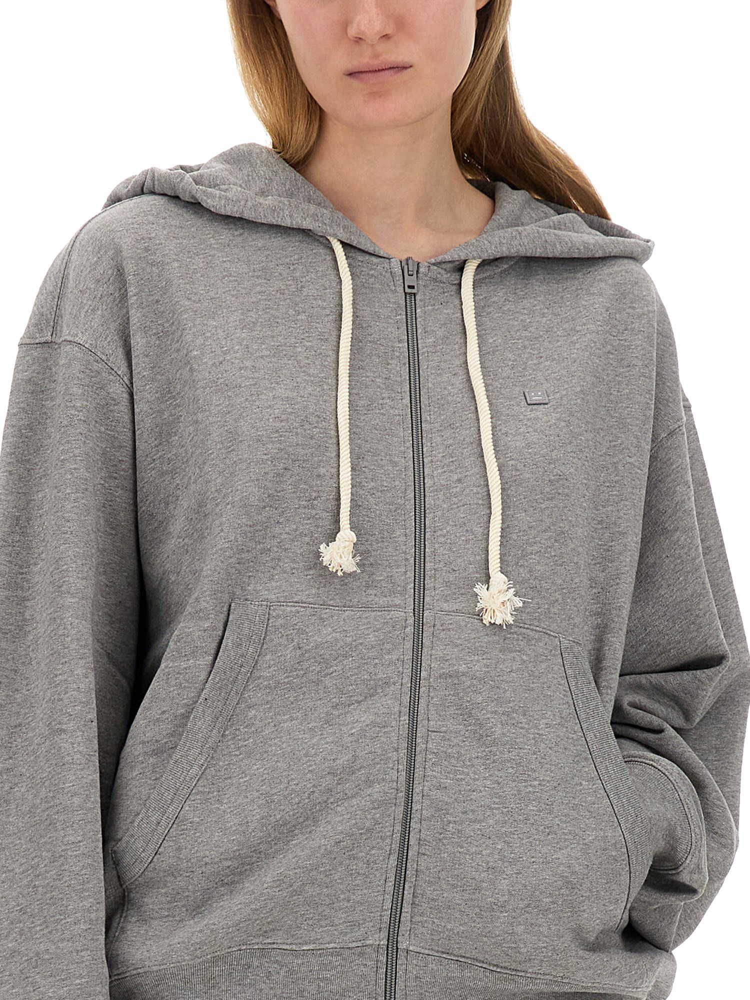 ACNE STUDIOS    ZIPPERED SWEATSHIRT WITH FACE PATCH